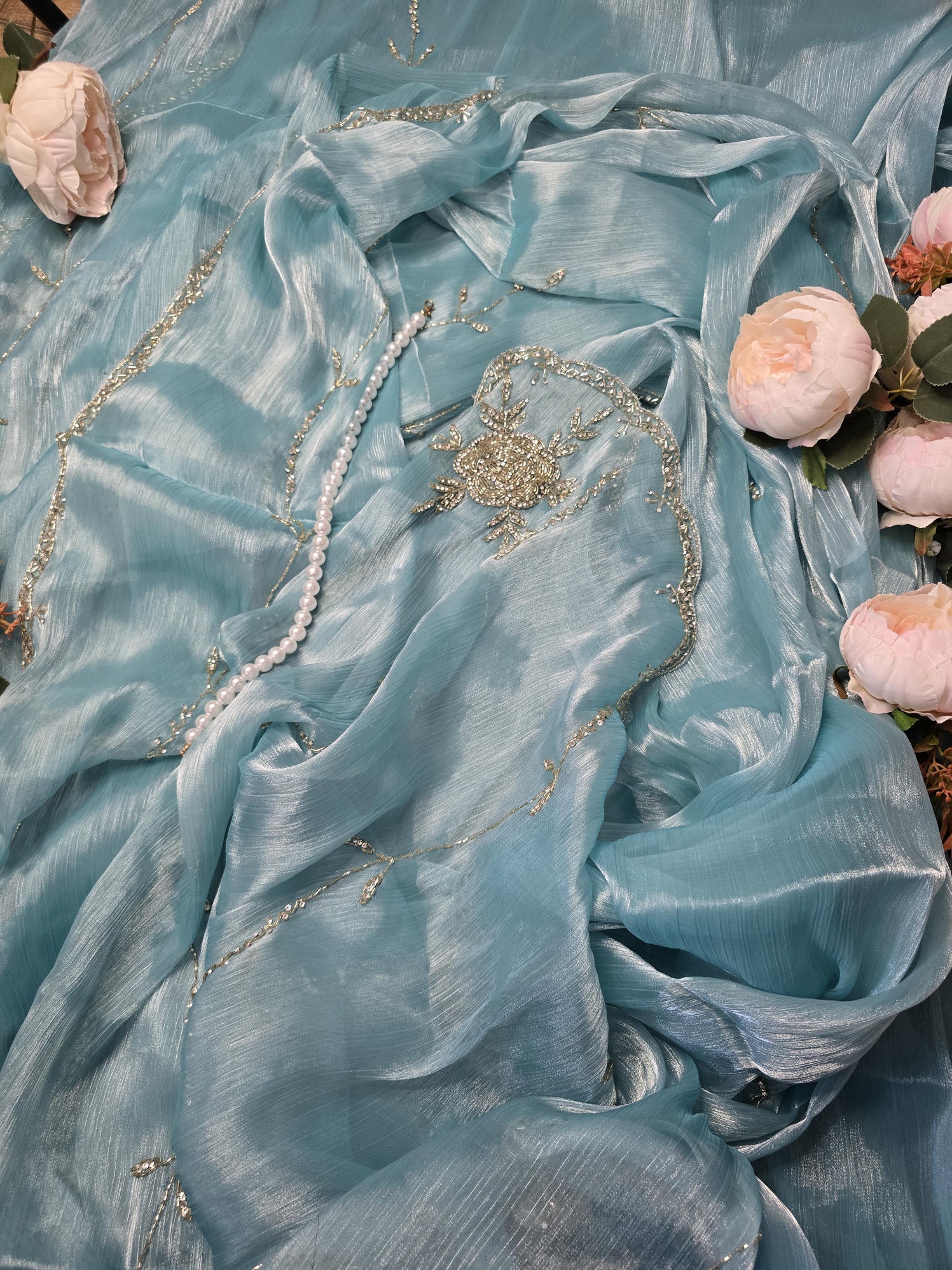 Light Sky Saree with Intricate Rose Embroidery, Silver Cut Dana, and Stone Work